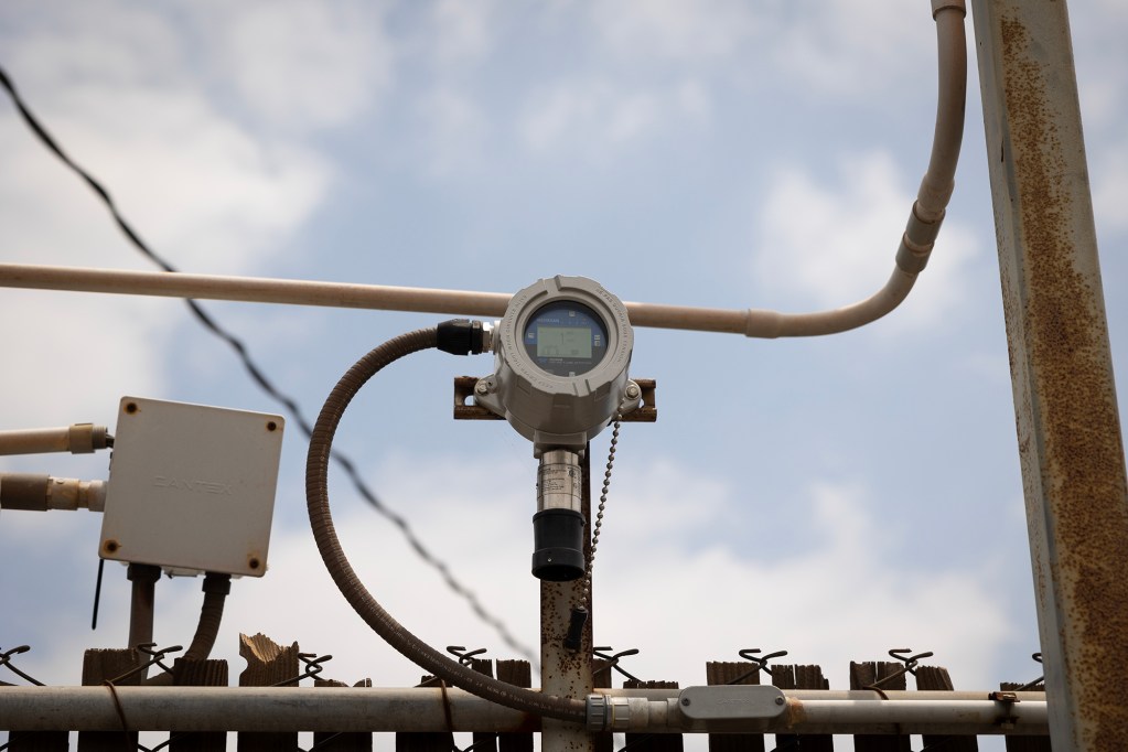 An air quality monitor on a fence line at Phibro-Tech Inc. in Santa Fe Spring on June 8, 2023. Photo by Miguel Gutierrez Jr., CalMatters
