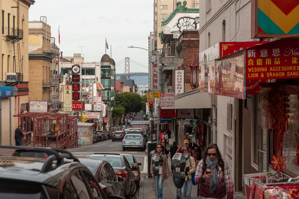 Tourists and residents walk around San Francisco’s Chinatown neighborhood on Feb. 18, 2023.