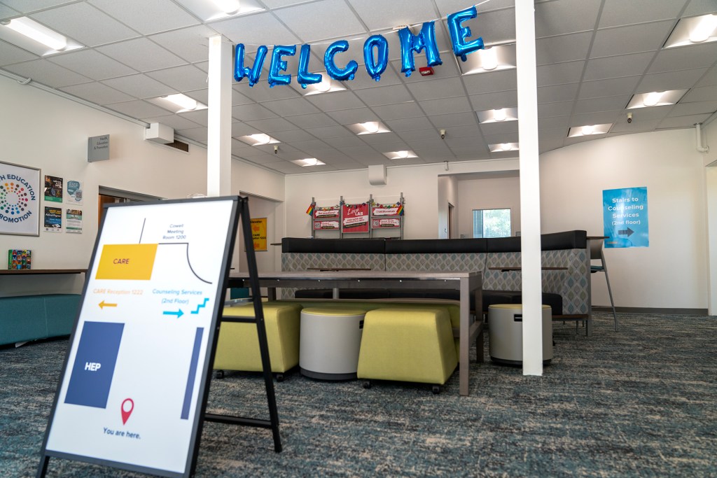 Balloons spell out "Welcome" at in the lobby of a general meeting area at the